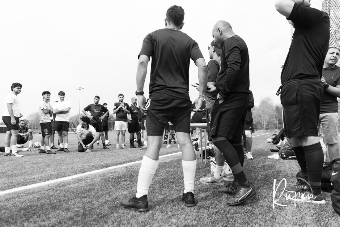 A football huddle from behind