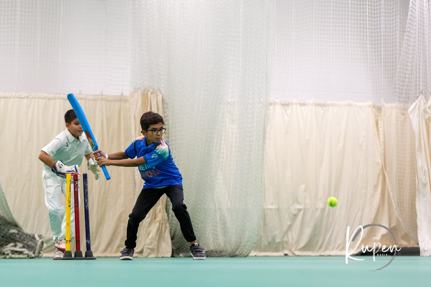 Badminton doubles pair at the net during a rally