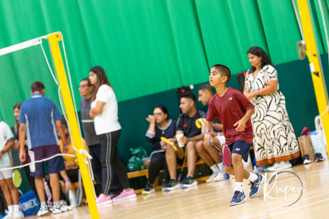 The bench erupting behind the net
