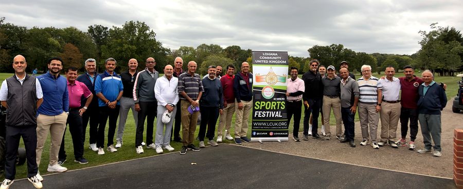 The full field of Golf Day players lined up outside the clubhouse at Stanmore Golf Club with the Lohana Sports Festival banner