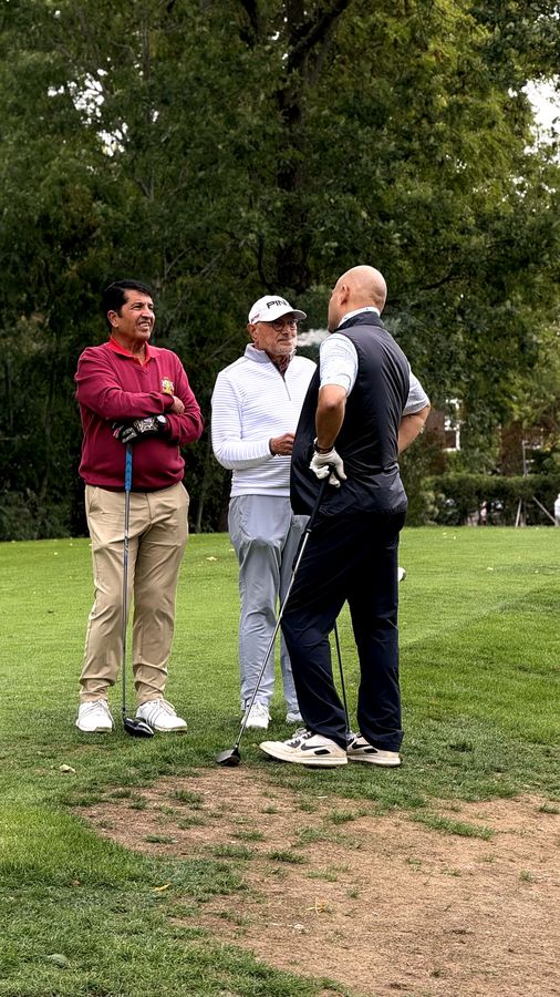 Three golfers talking on the tee before the first drive of the Lohana Sports Festival Golf Day