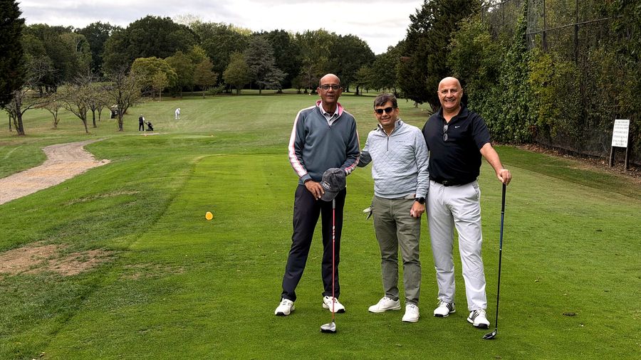 Three golfers standing on the fairway at Stanmore Golf Club during the Lohana Sports Festival Golf Day